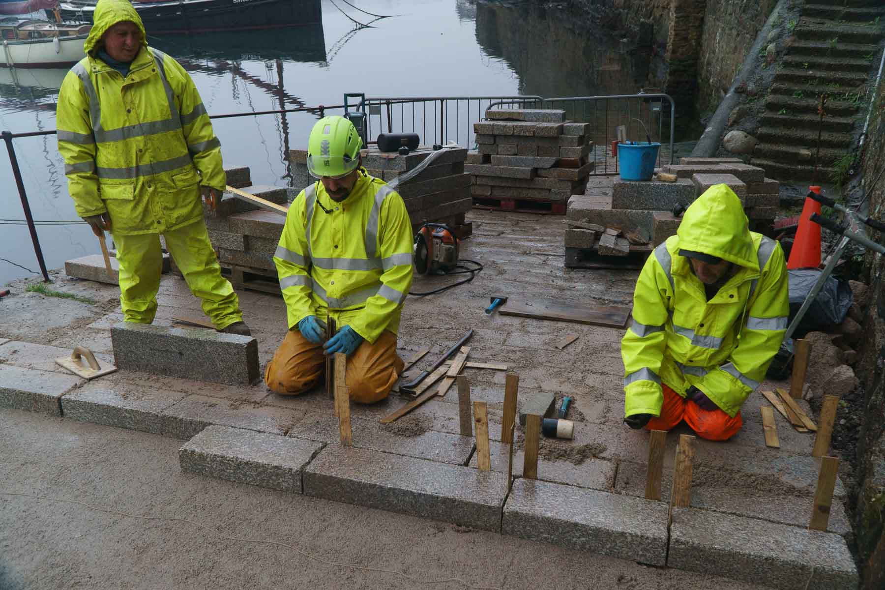 Wooden wedges accurately position the stone setts