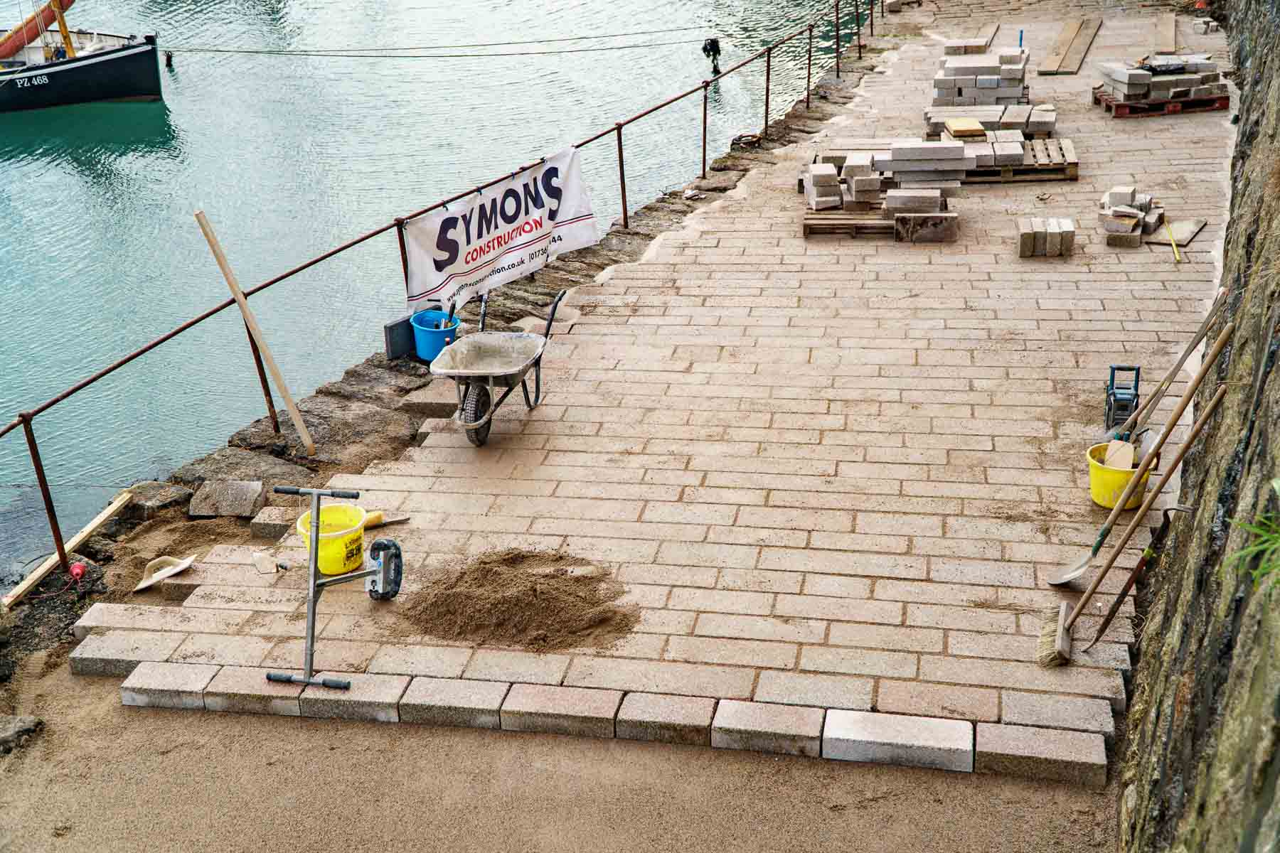 Lime mortar pointing the slip edges is underway