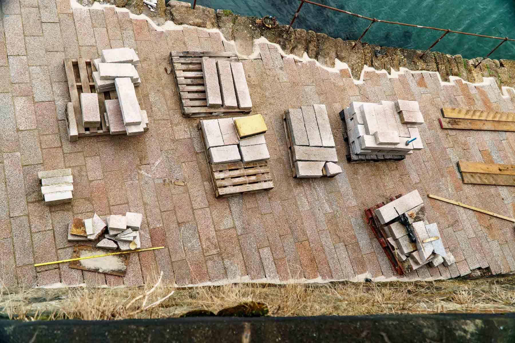 Waiting pallets of granite setts