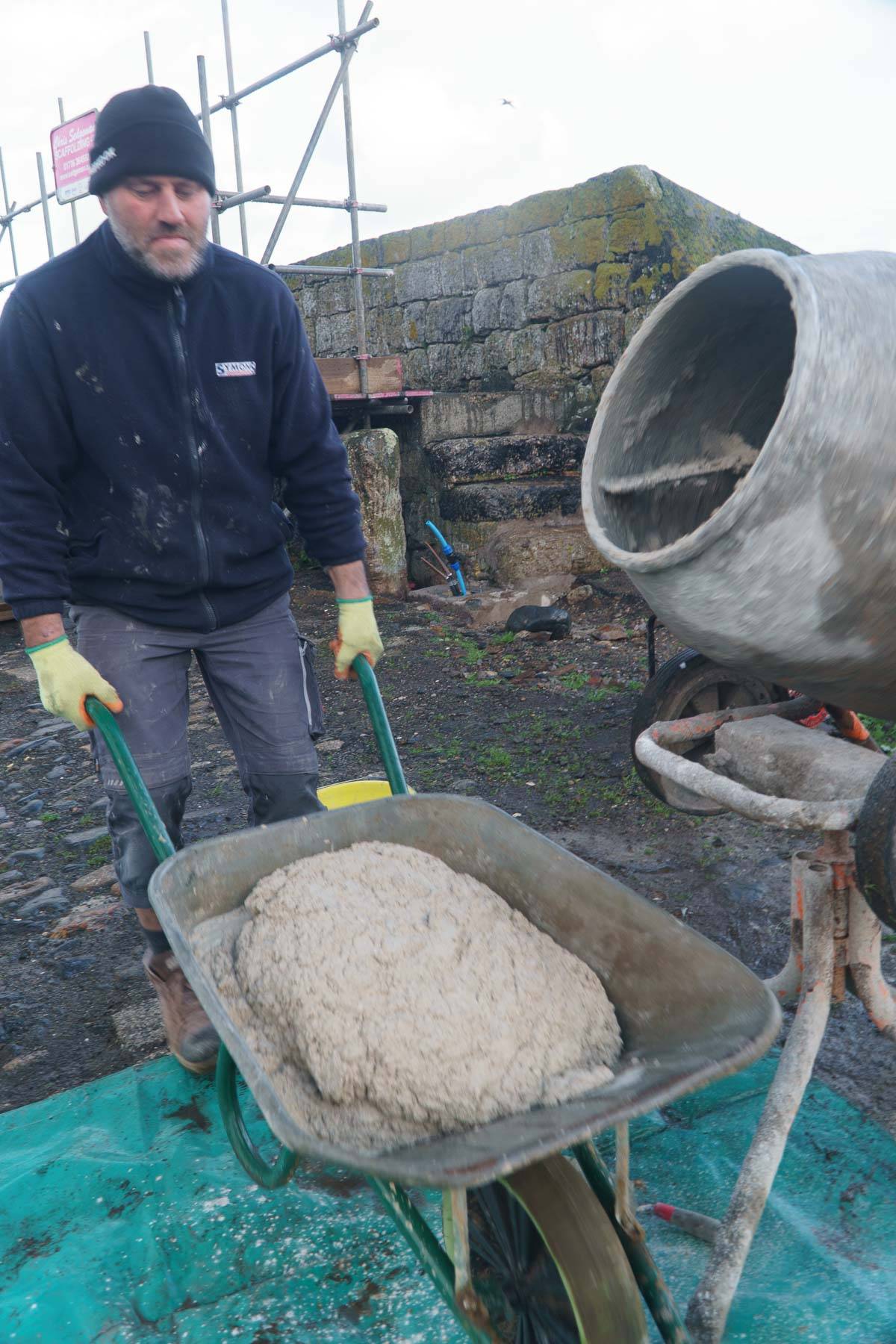 Wheelbarrow full of ime mortar